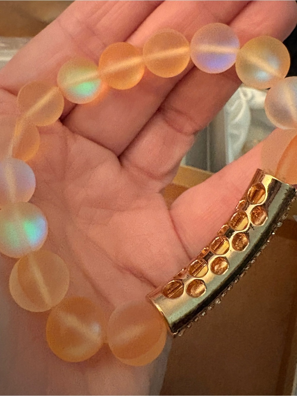 Gold and Rhinestone Iridescent Fun Accent Frosted Peach Bead Stretch Bracelet